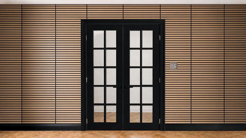 Horizontal slat-wood wall surrounding black French doors
