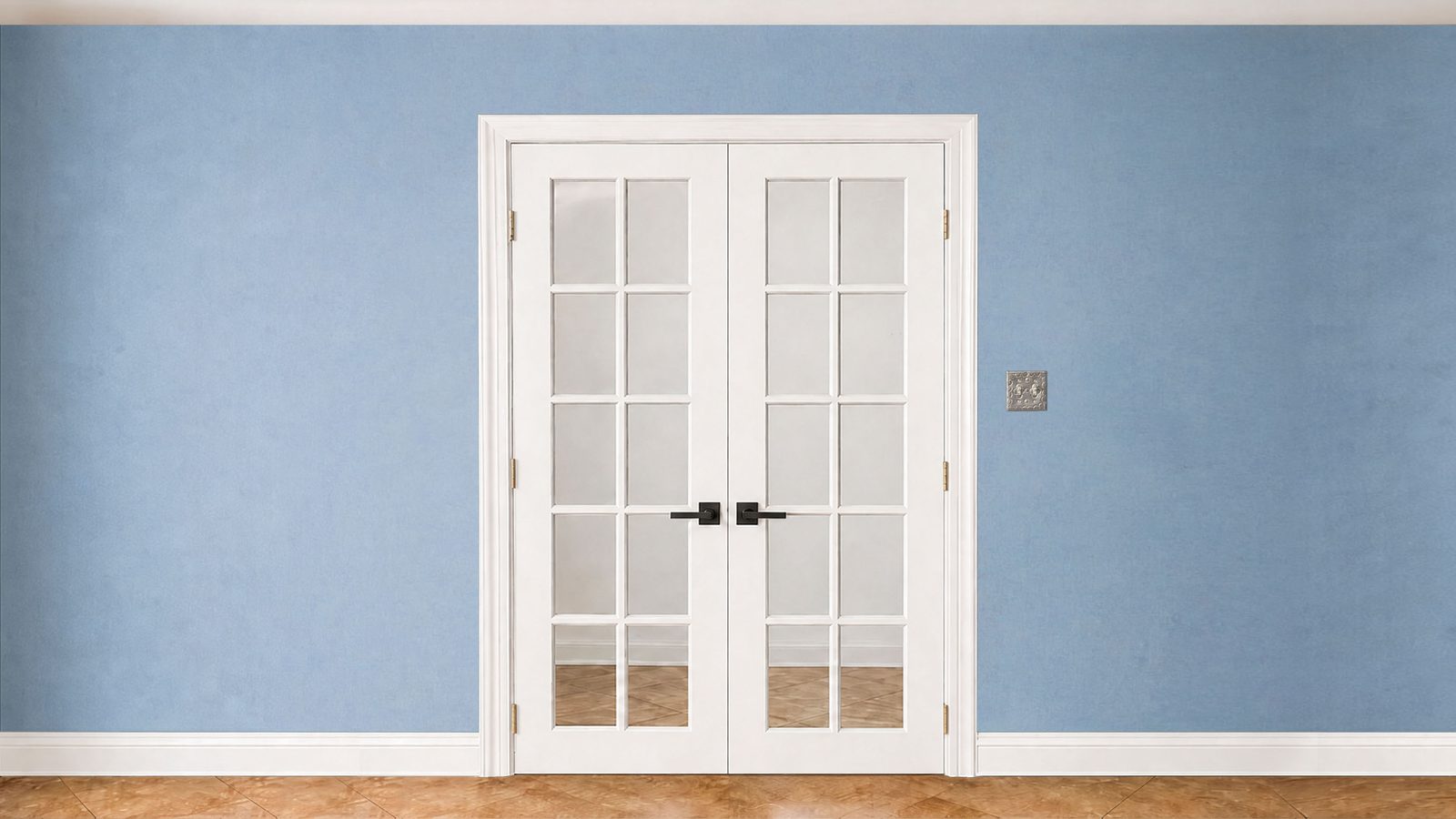 Wall with white French doors set against a plain blue painted wall